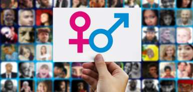 Symbol Frau und Mann auf weißen Schild, im Hintergrund verschiedene Gesichter